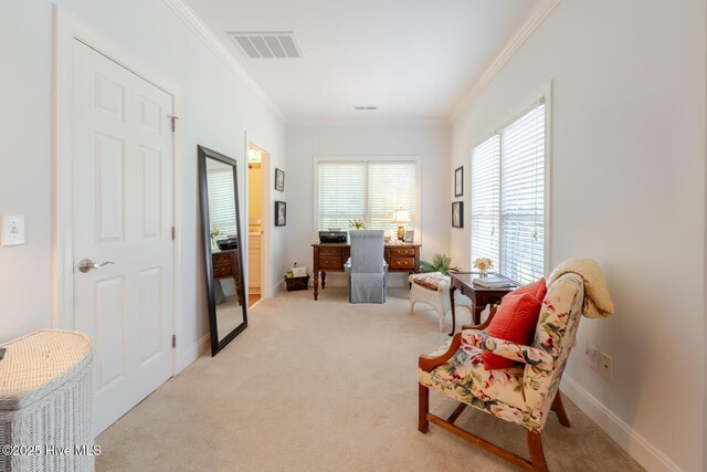 sitting room with crown molding, light colored carpet, baseboards, and visible vents