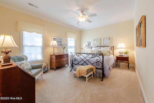 bedroom featuring light carpet, visible vents, crown molding, and ceiling fan