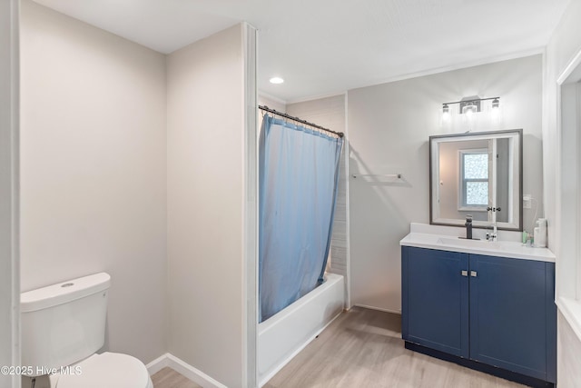 907 Bonham Ave, Wilmington, NC 28403 - full bath featuring wood finished floors, toilet, vanity, baseboards, and shower / tub combo