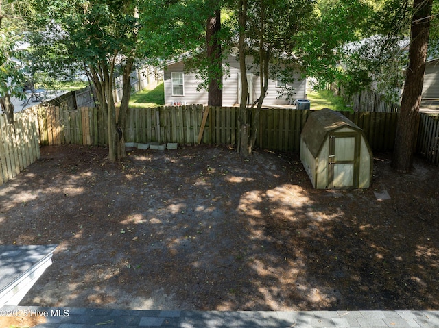 907 Bonham Ave, Wilmington, NC 28403 - view of yard with a fenced backyard, an outbuilding, and a storage unit