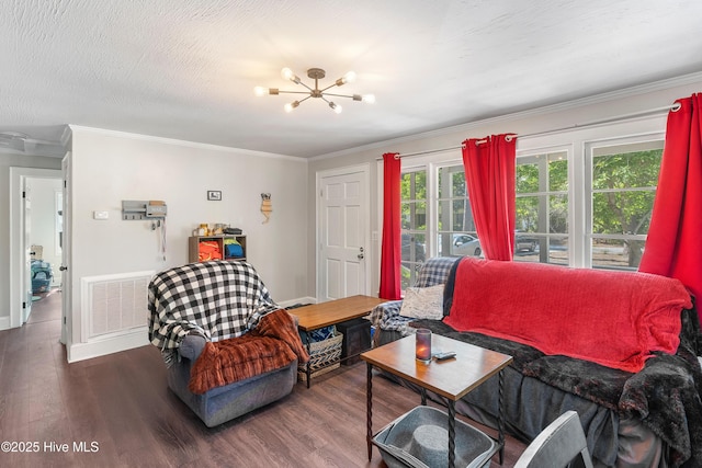 907 Bonham Ave, Wilmington, NC 28403 - living room with ornamental molding, wood finished floors, a chandelier, and visible vents