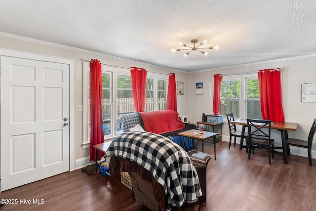 907 Bonham Ave, Wilmington, NC 28403 - interior space featuring baseboards, wood finished floors, a notable chandelier, and ornamental molding