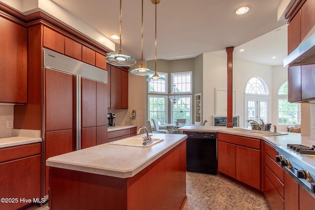 kitchen with light countertops, black dishwasher, a sink, and a wealth of natural light