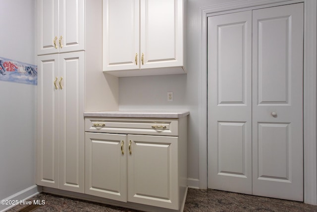interior space featuring baseboards