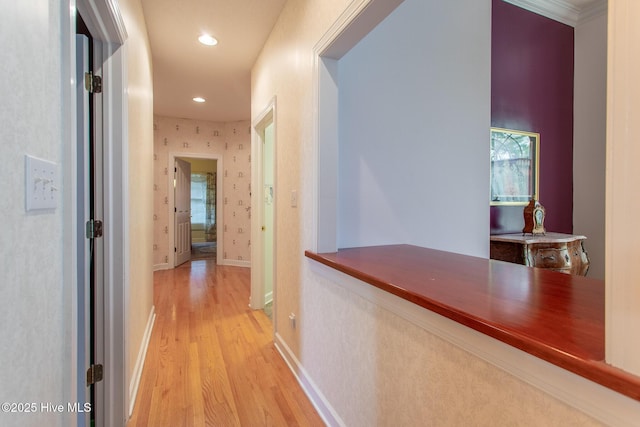 corridor featuring wood finished floors, baseboards, and recessed lighting