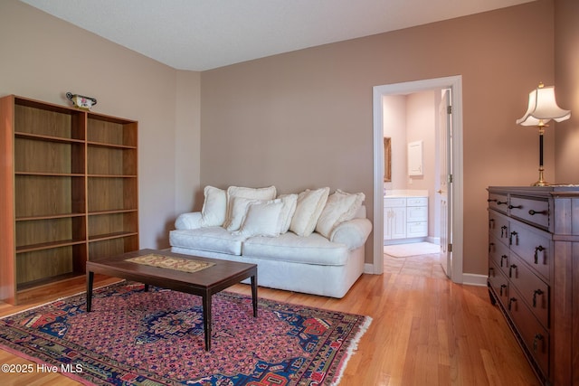 living room featuring light wood-style floors and baseboards