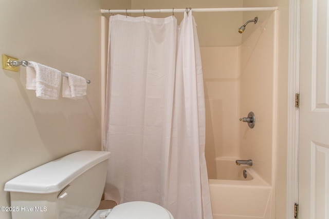 full bathroom featuring toilet and shower / bath combo with shower curtain