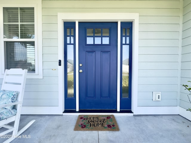 property entrance featuring covered porch