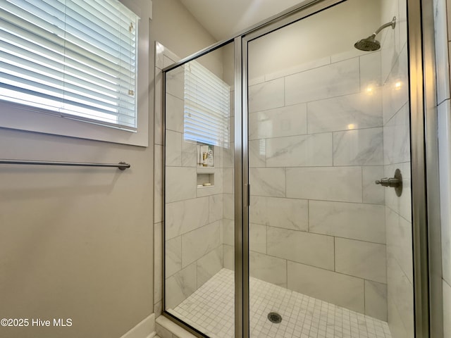 bathroom featuring a shower stall
