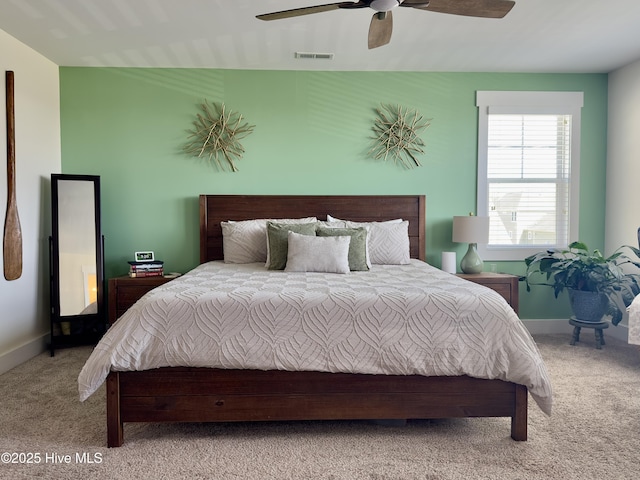 bedroom featuring carpet flooring, baseboards, a ceiling fan, and visible vents