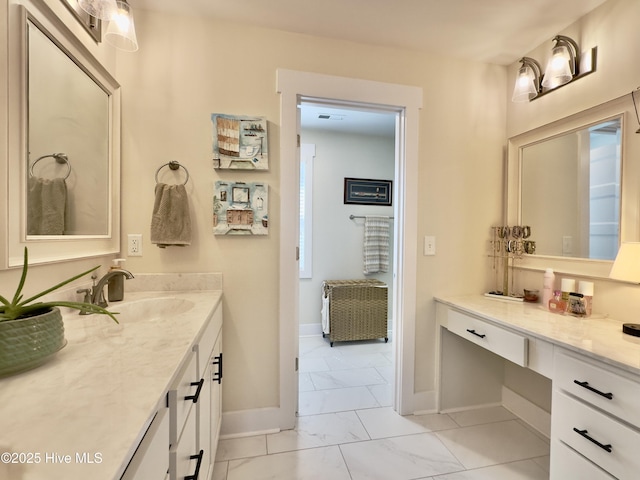 bathroom featuring vanity, baseboards, marble finish floor, and visible vents
