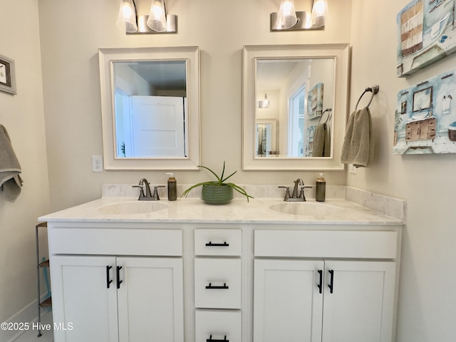 full bath featuring a sink and double vanity