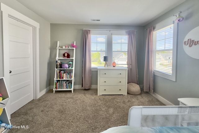 bedroom featuring carpet floors, baseboards, and visible vents