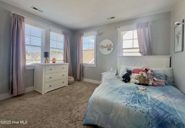bedroom featuring carpet floors, visible vents, and multiple windows