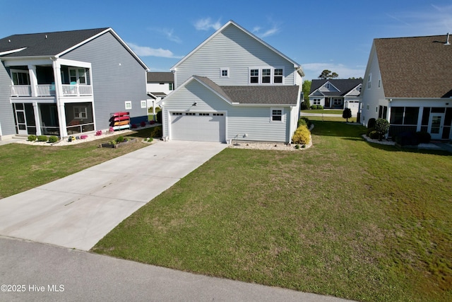 view of front of property with concrete driveway, a sunroom, and a front lawn
