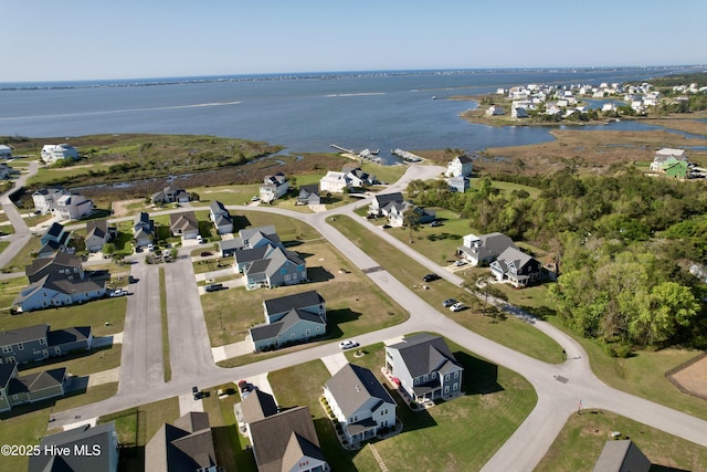 bird's eye view with a water view and a residential view