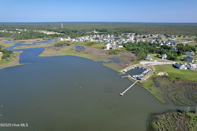 birds eye view of property with a water view and a residential view