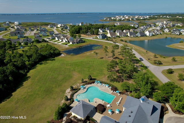 bird's eye view featuring a water view and a residential view