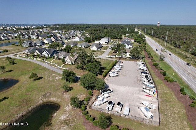 aerial view with a water view and a residential view