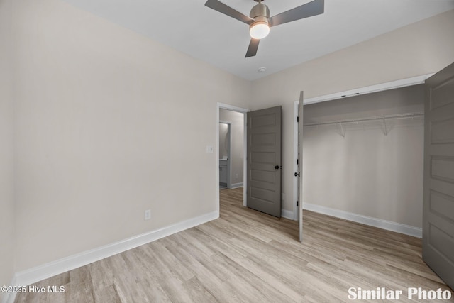 unfurnished bedroom featuring a closet, baseboards, light wood finished floors, and ceiling fan