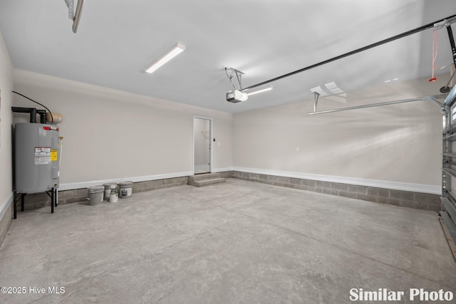 garage with electric water heater and a garage door opener
