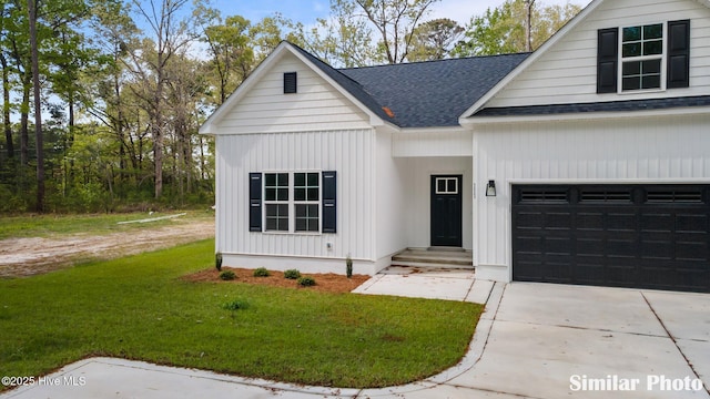 modern farmhouse featuring an attached garage, a shingled roof, driveway, and a front lawn