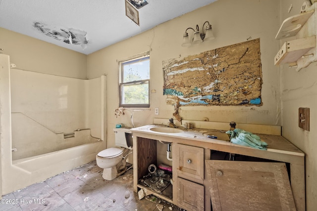 bathroom with toilet, vanity, and shower / bathtub combination