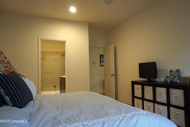 bedroom featuring recessed lighting and ensuite bath