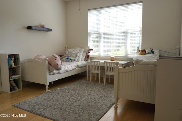 bedroom with wood finished floors