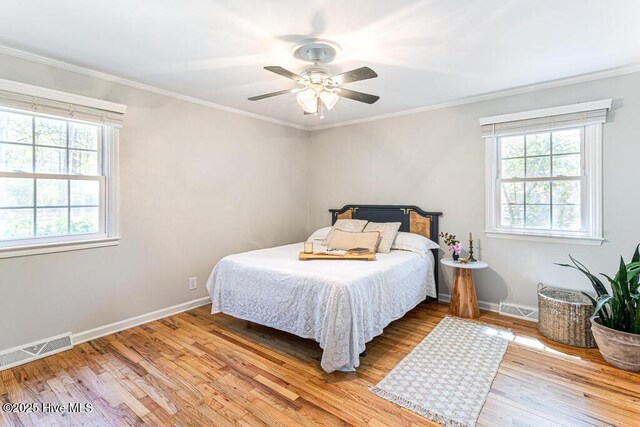 1369 Linden Rd, Aberdeen, NC 28315 - bedroom with light wood-style floors, crown molding, baseboards, and a ceiling fan