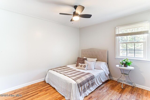 1369 Linden Rd, Aberdeen, NC 28315 - bedroom with light wood-type flooring, baseboards, ornamental molding, and ceiling fan