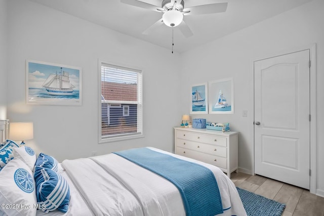 bedroom featuring a ceiling fan and light wood-style floors