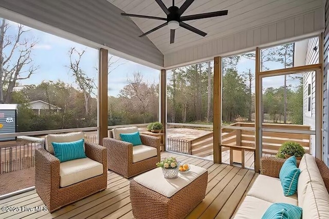 sunroom with outdoor lounge area and a ceiling fan