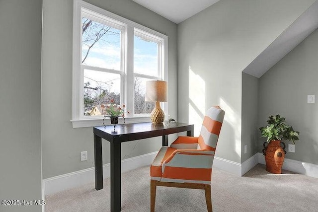 carpeted home office featuring baseboards