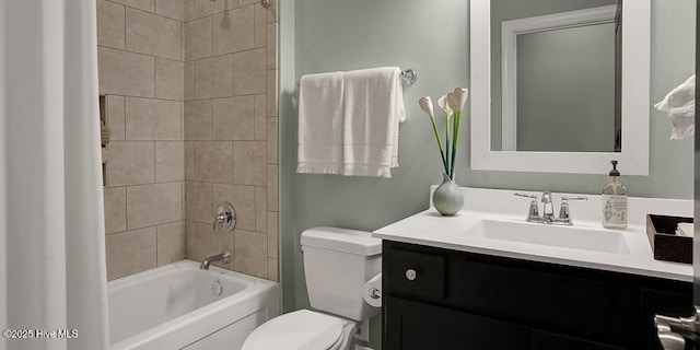 bathroom with toilet, shower / washtub combination, and vanity