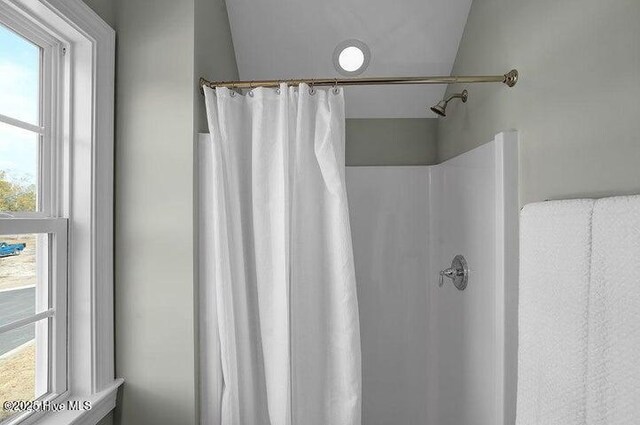 bathroom with a shower with curtain