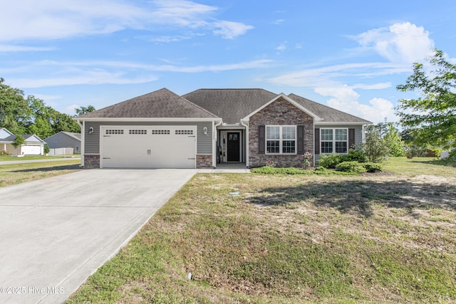 ranch-style home with an attached garage, driveway, and a front yard