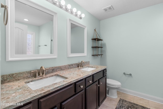 full bathroom with a sink, baseboards, tile patterned flooring, and visible vents