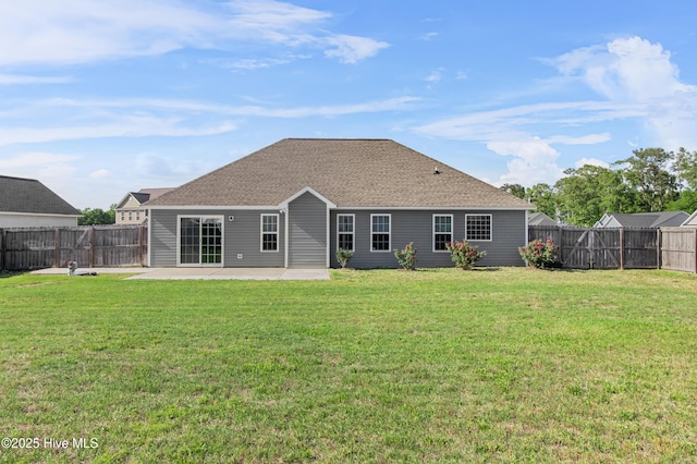back of house featuring a fenced backyard, a patio area, and a yard