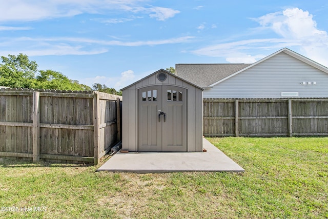 view of shed featuring a fenced backyard