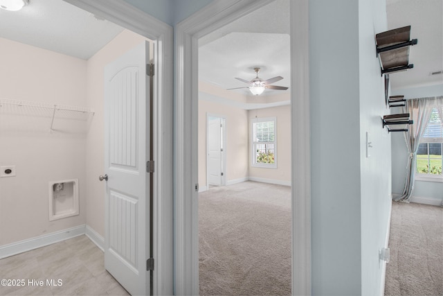 hall featuring baseboards, carpet flooring, and visible vents
