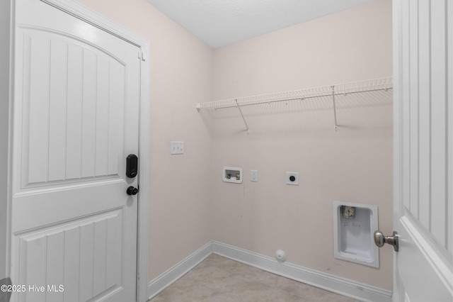 laundry area with laundry area, washer hookup, gas dryer hookup, baseboards, and hookup for an electric dryer