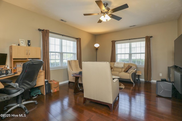 office with visible vents, a ceiling fan, baseboards, and dark wood-style flooring