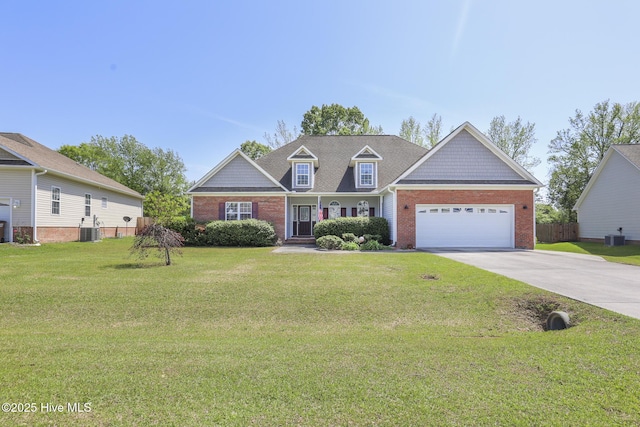 traditional home with driveway, central AC, brick siding, an attached garage, and a front yard