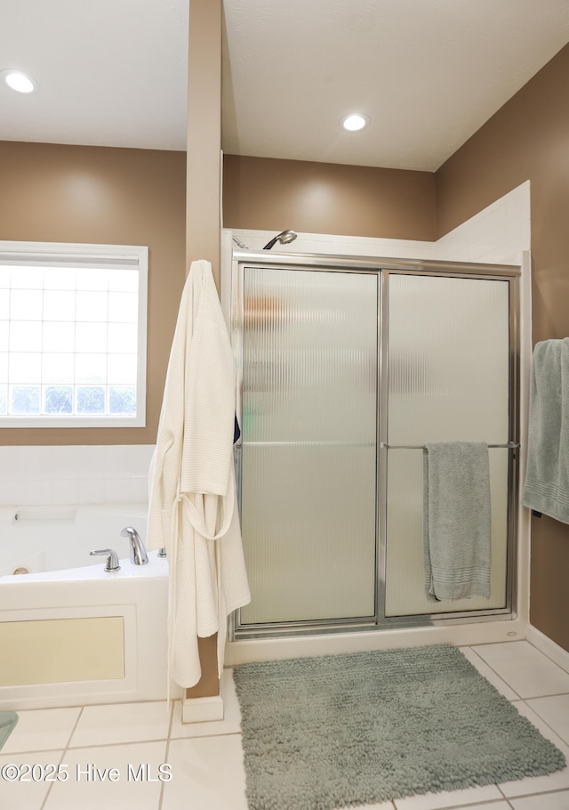 bathroom with recessed lighting, a garden tub, tile patterned floors, and a stall shower