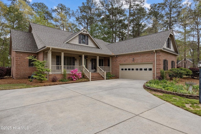 craftsman house featuring roof with shingles, a porch, concrete driveway, brick siding, and a garage