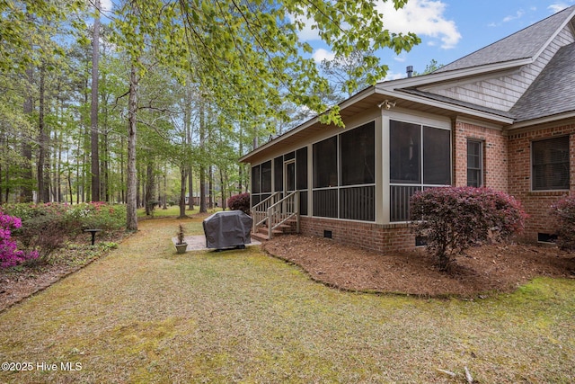 view of yard with a sunroom