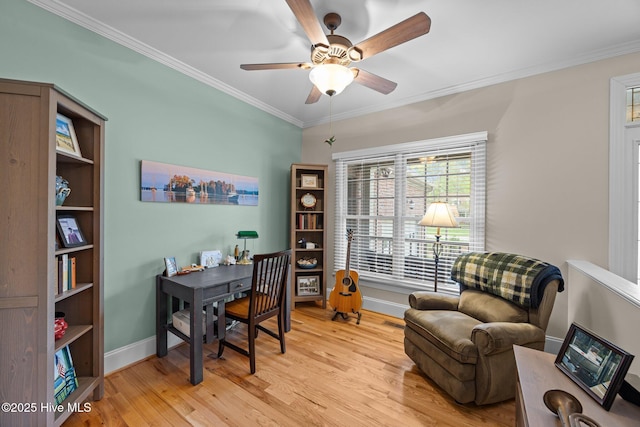 office space with a ceiling fan, baseboards, ornamental molding, and light wood finished floors