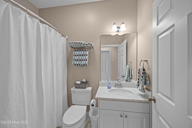 full bath featuring toilet and vanity