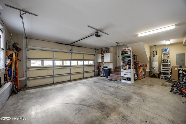 garage with gas water heater, electric panel, and a garage door opener